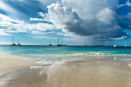 Boats with a storm cloud in the distance